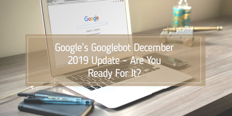 office desk with notebook, pens, cell phone and computer on it. computer screen is opened to homepage of Google