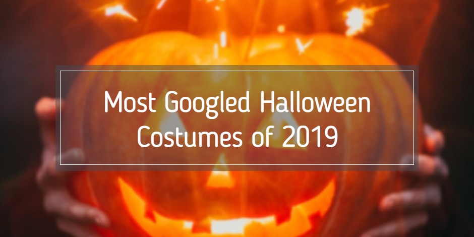 someone's hands around a carved pumpkin on Halloween