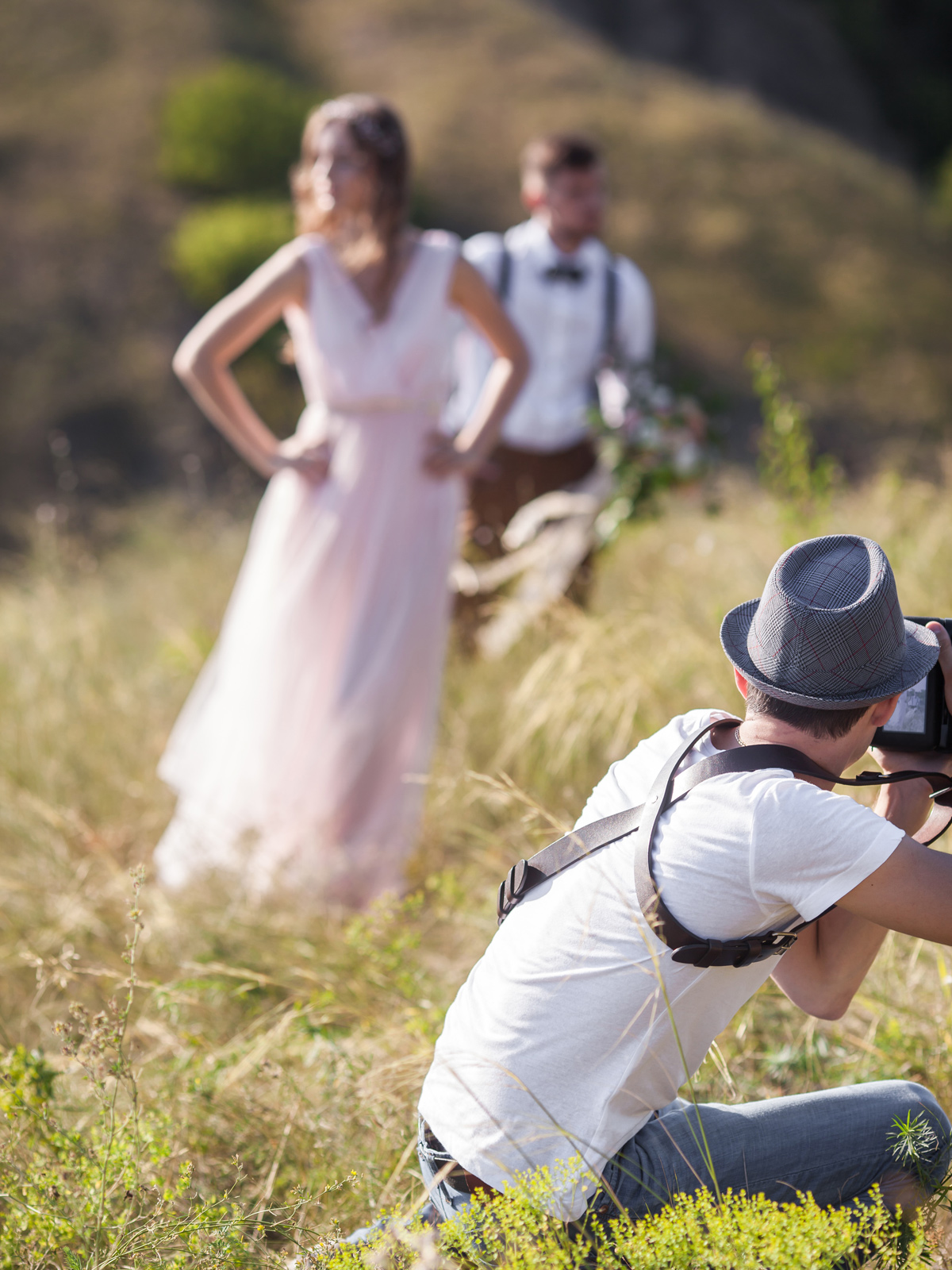 Photographer taking photos of a couple on their wedding