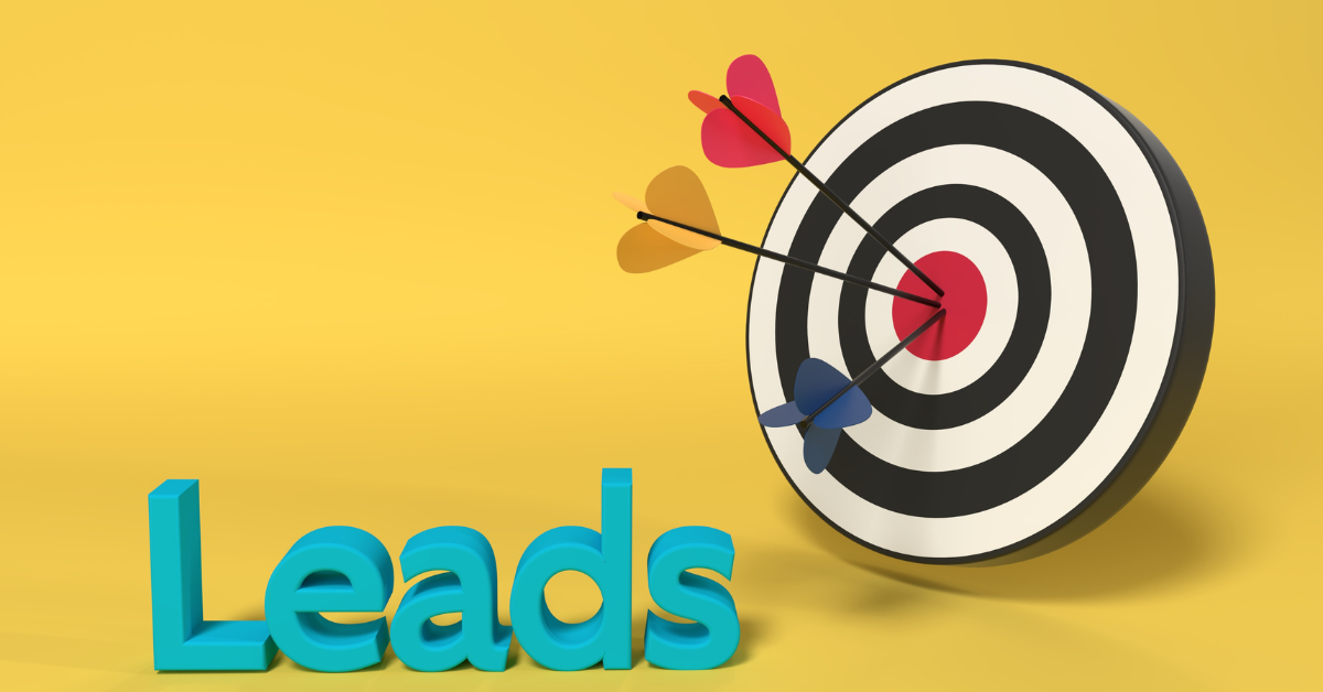 A dart board with several darts thrown. The text "leads" is present next to the board.