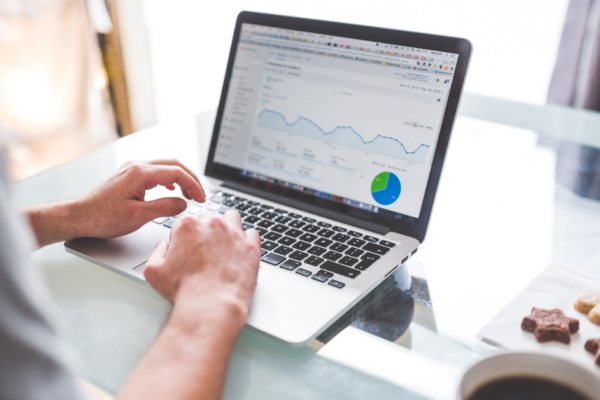 A person looking at SEO metrics on their laptop