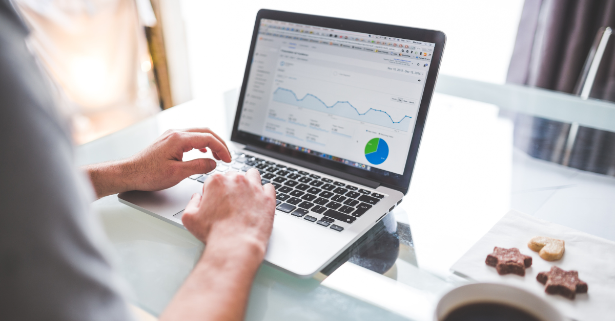 A person looking at SEO metrics on their laptop