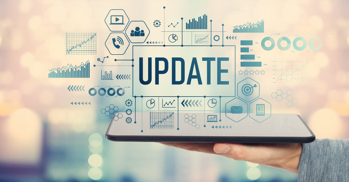 The word "update" is pictured atop a tablet surrounded by marketing icons.