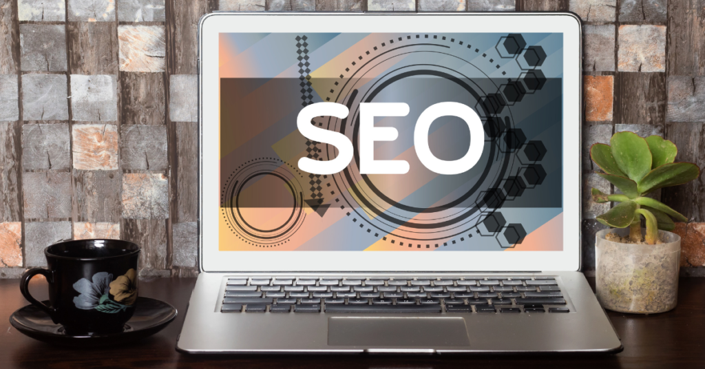 Computer displaying "SEO" on the screen