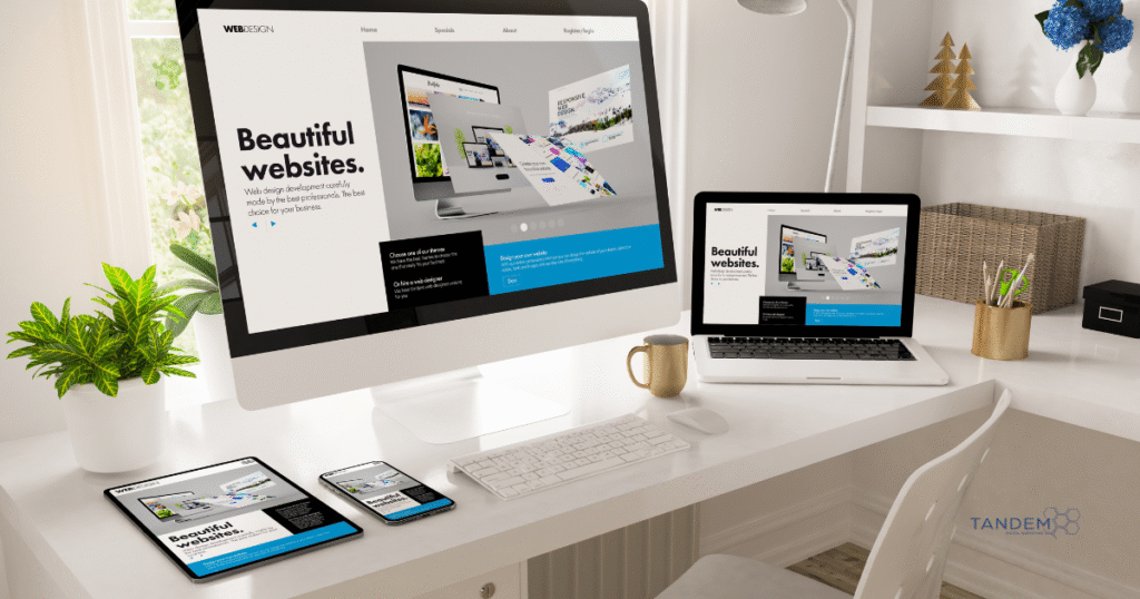 Desktop, laptop, tablet, and smartphone all displaying a responsive website homepage, highlighting CMS-based web design tools; Tandem Digital Marketing logo in the corner.