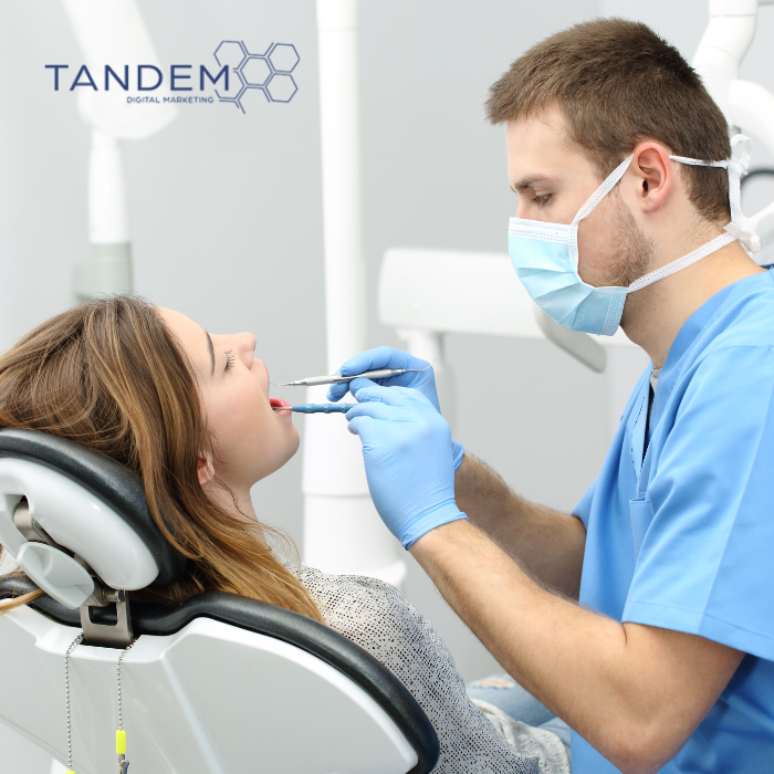 Dentist cleaning patients teeth
