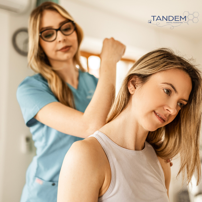 Chiropractors massaging patients back