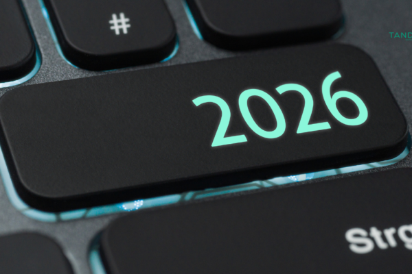 A high-quality, close-up shot of a sleek black computer keyboard with a glowing "2026" key and the Tandem Interactive logo, representing cutting-edge digital marketing trends and annual strategy updates.