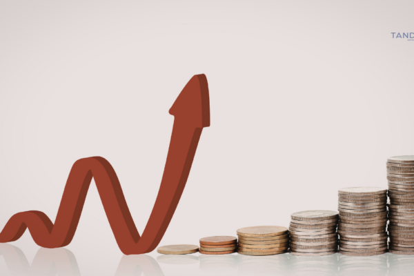 A professional graphic featuring a rising red performance arrow next to stacks of coins, representing Tandem Interactive’s strategy for eliminating Google Ads budget waste and increasing PPC efficiency.