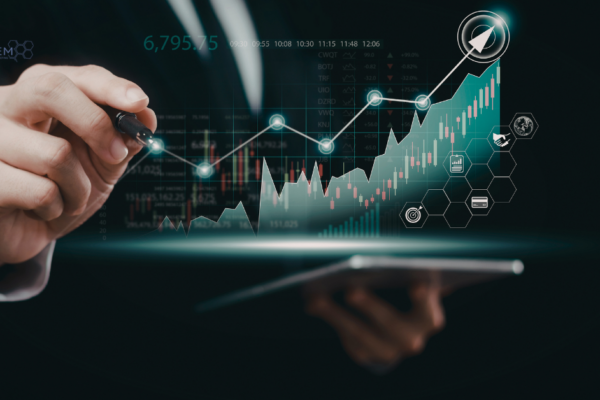 A professional digital marketer using a stylus to interact with a glowing financial growth chart on a tablet, featuring Tandem Interactive branding and icons representing e-commerce and global marketing reach.