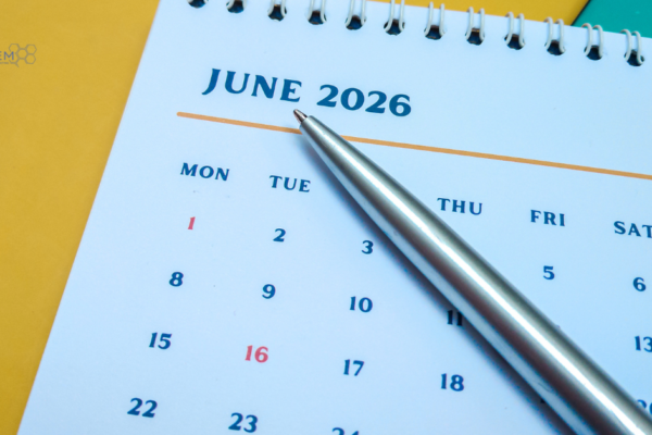 June 2026 Digital Marketing Updates and Mid Year Strategy Calendar A clean, close up view of an open spiral calendar page displaying June 2026 with a silver pen resting on top, featuring Tandem Interactive branding for our midyear digital marketing updates.